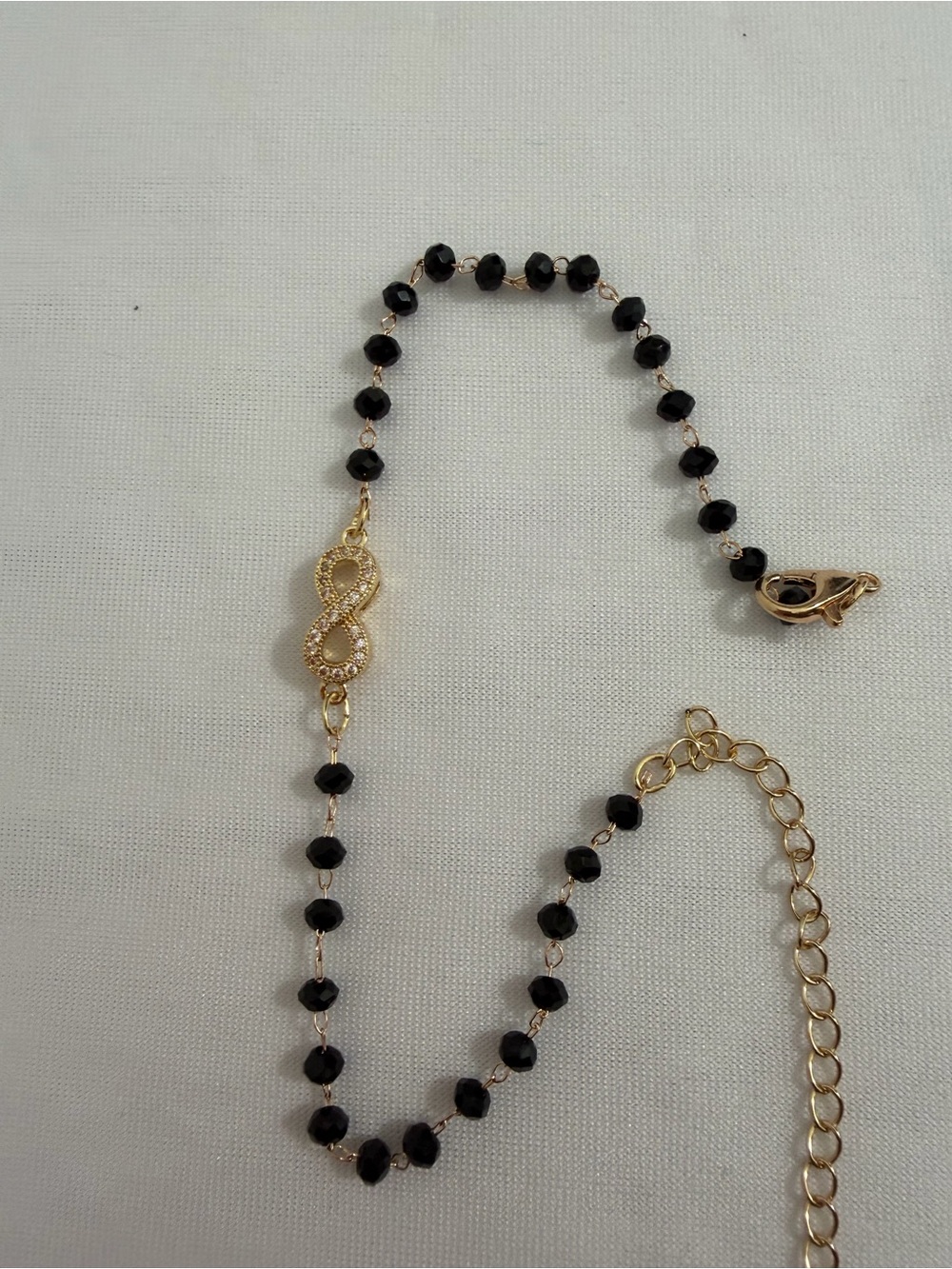 Gold Infinity Pendant anklet with Black Beads
